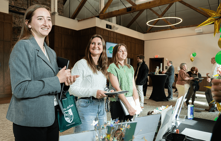 Group of students listening attentively while smiling